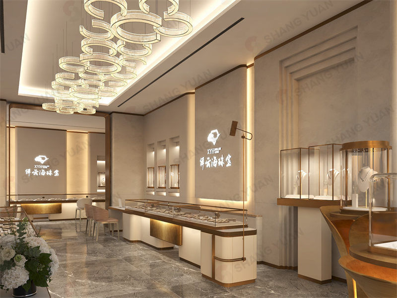 Luxurious modern jewelry store interior featuring ring-shaped chandeliers and custom glass display showcases